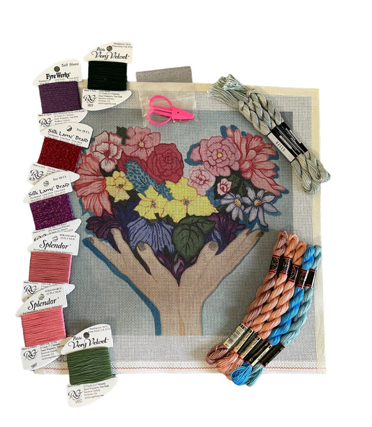 Floral needlepoint kit with a variety of blooming flowers and Silk Lamé Braid threads in multiple shades.