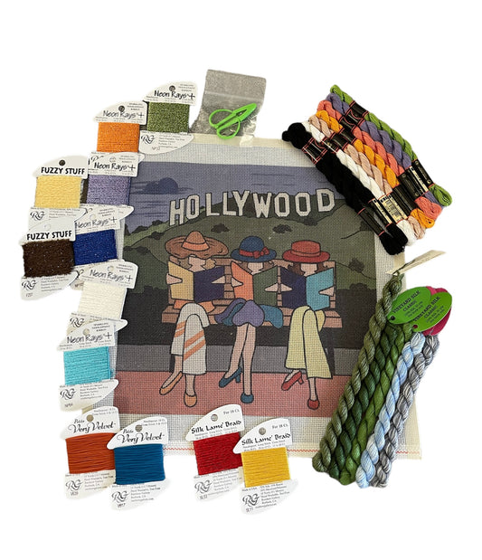 Needlepoint kit featuring a Hollywood theme with vintage female silhouettes and a range of vibrant threads and fibers.