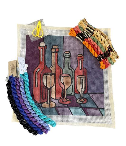 Wine Time needlepoint kit displaying an array of wine bottles and glasses, accompanied by richly colored threads and Silk Lamé Braid.