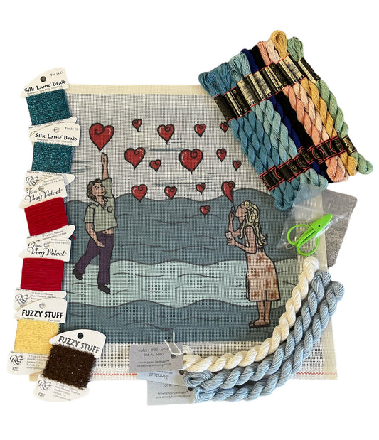 Romantic beach scene needlepoint kit with a couple and hearts, including Fuzzy Stuff and Very Velvet threads in soft, warm tones.